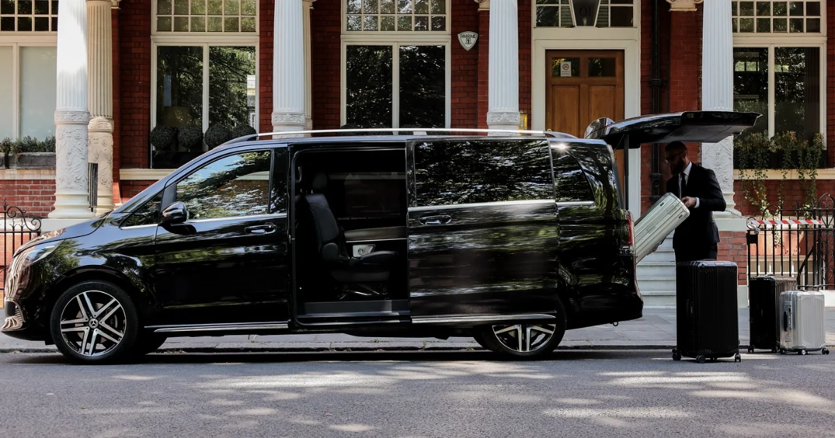 Luxury chauffeur service Milton Keynes electric Mercedes car at night