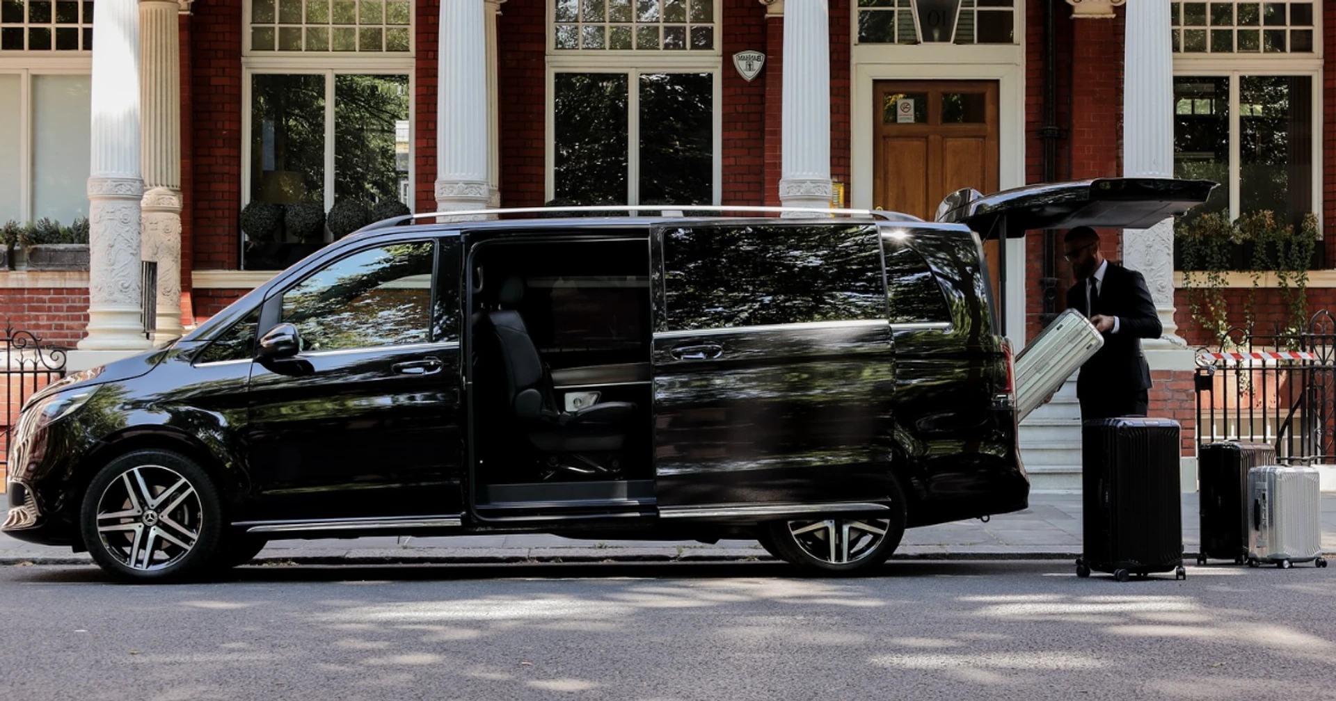 Chauffeur service Mayfair London luxury car outside a Georgian townhouse